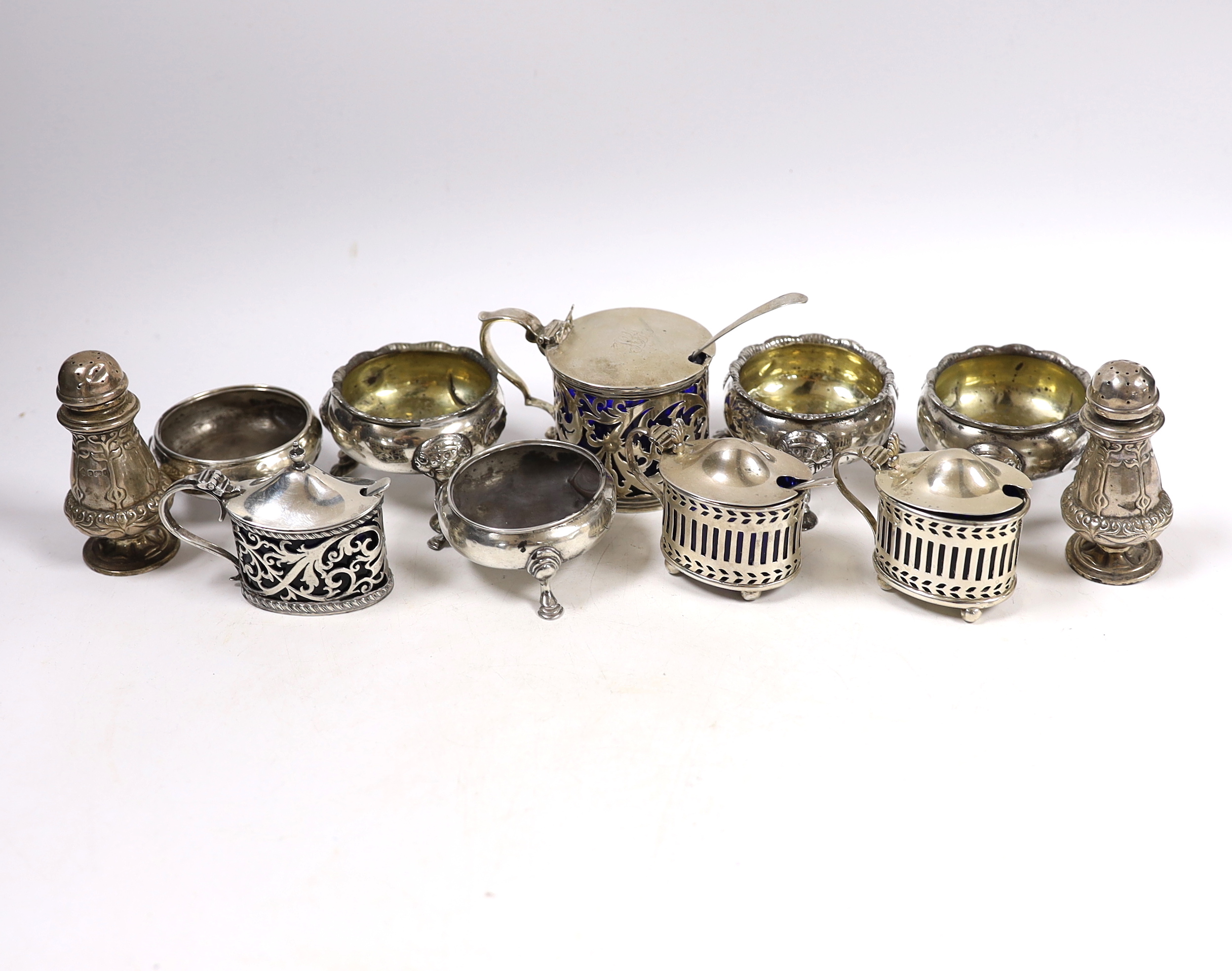 Eleven assorted antique and later silver bun salts, pepperettes and mustard pots including Victorian drum mustard, London, 1853.